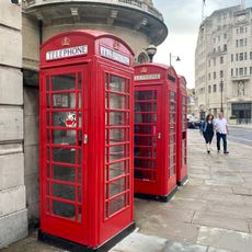 Group Of 3 K6 Telephone Kiosks Adjacent To Former Langham Hotel