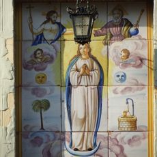 Ceramic panel of the Immaculate at Ramón y Cajal street