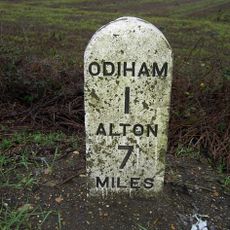Milestone, SW edge of Airfield, nr jct with private road