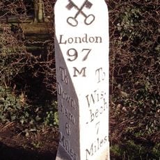 Milepost, just W of entrance to Mullicourt Priory Farm