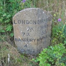 Milestone, rear northern village turn