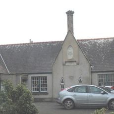 Old School to S of St Beuno's Church against churchyard