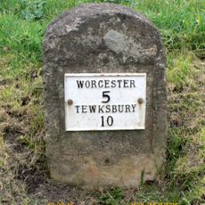 Milestone, Baynhall, on pull-in, 30m N of car sales garage