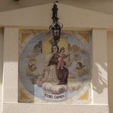Ceramic panel of Our Lady in Mount Carmel at 2 Rosario street