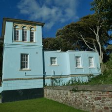 Lodge And Gatepiers To West Entrance To Tapeley Park