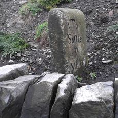 Milestone, ExYW Newsholme, just N of railway bridge