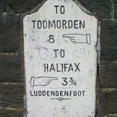 Milepost Set In Wall Opposite United Reformed Church