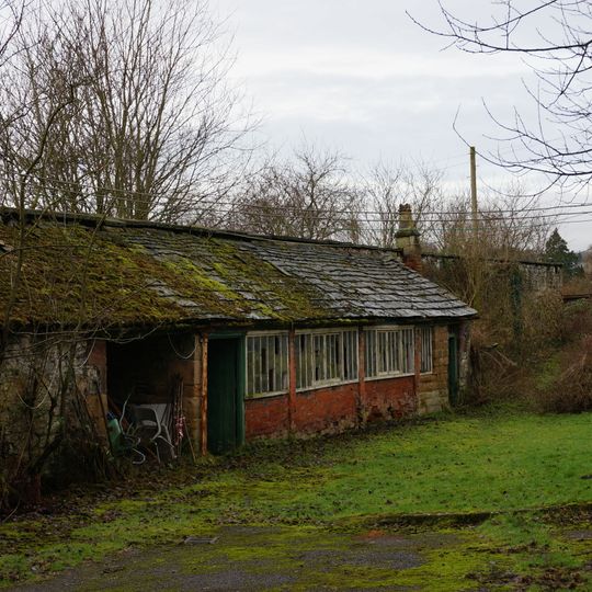 Kitchen garden walls with attached potting sheds at The Brooklands