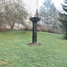 Kovová plastika Řecký oheň nad hřbitovem v Rakovníku