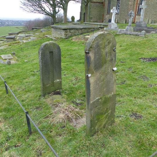 Stocks in graveyard of Church of St Thomas the Apostle