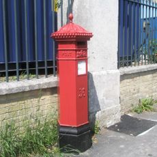 Pillar Box, Immediately In Front Of The Station Forecourt Railings, In A Central Position