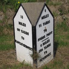 Milepost near Carew Cricket Ground