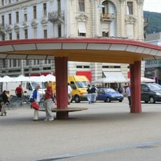 People shelter and lighting candelabra
