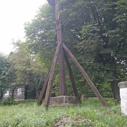Bell tower, fountain and column in Lhota