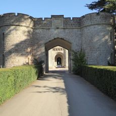 Portcullis Lodge And Retaining Walls To Forecourt Of Eastnor Caslte