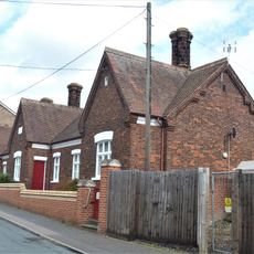 Almshouses Including Surrounding Wall And Outbuildings