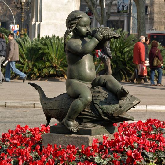 Niños cabalgando sobre peces