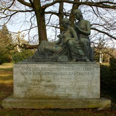 Two seated female figures