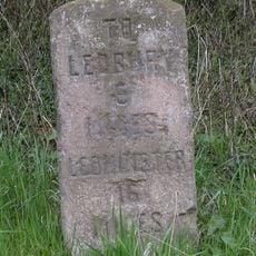 Milestone, N of village 50m N of lay-by