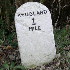 Milestone, minor road from B3351 to Swanage; 300M W of junction with B3351