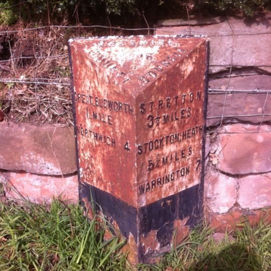 Milepost, Gibb Hill, in angle of Pole Lane and drive to Belmont Hall