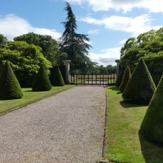 Pair of folding gates with screens and piers at south end of southern gardens