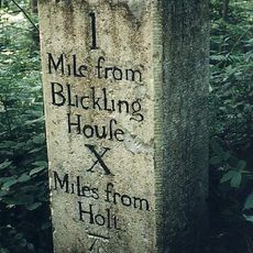 Milestone, opp. W end of wood, 10yds E of metal gate opp.