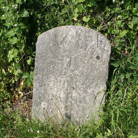 Milestone, Exeter Road, jct with Beardown Road, by Business Park