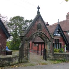 Entrance gate and flanking wall to Condlyffe Almshouses