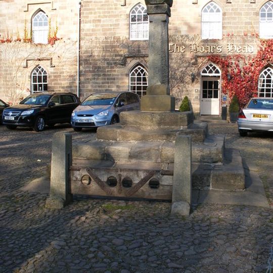 Village cross with sundial and stocks
