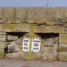 Milestone, Main Road, opp. UR church