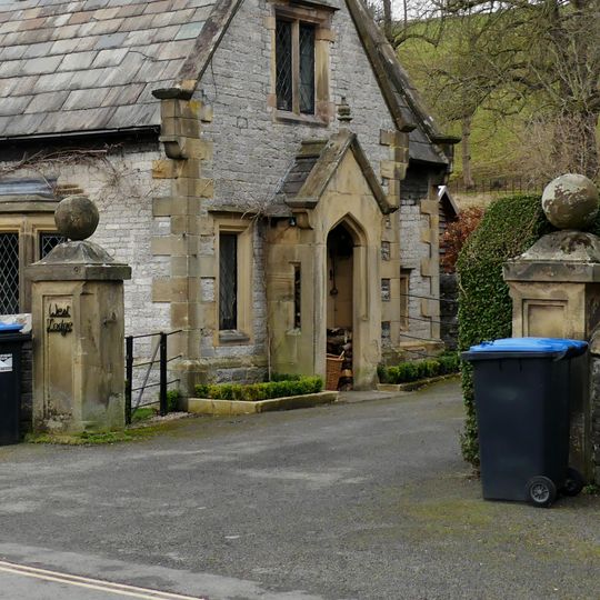 Entrance gate piers and attached walls at East and West Lodges to Holme Hall