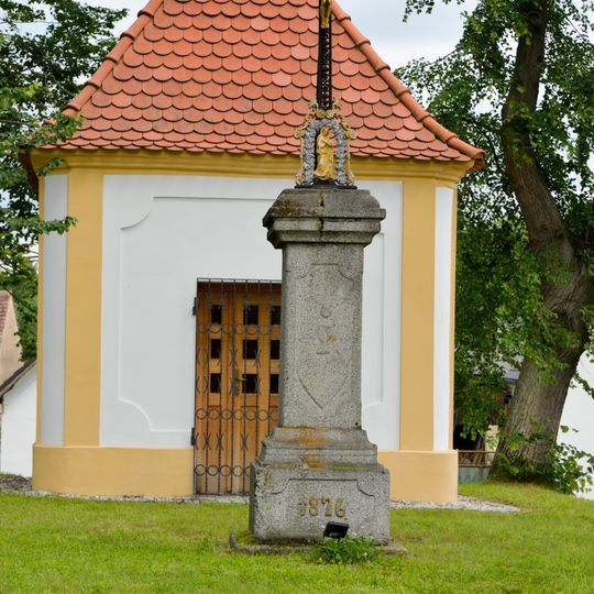 Wayside cross by chapel in Srby