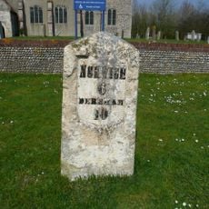 Milestone, by wall to St Peter's churchyard