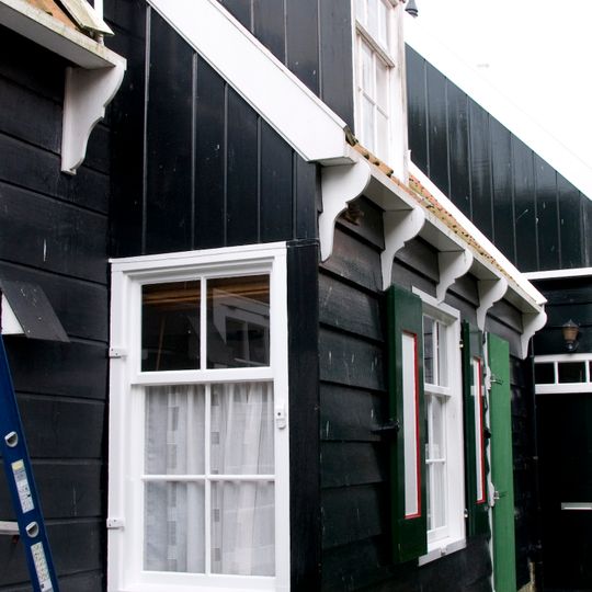 Perceelsgedeelte van een houten huis