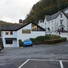 Summerhouse And Attached Retaining Wall And Terrace With Railings