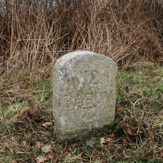 Milestone, 250m E of Northcote Cross, opp layby
