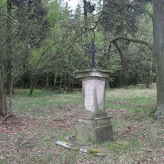 Kříž nad zámkem Hubenov