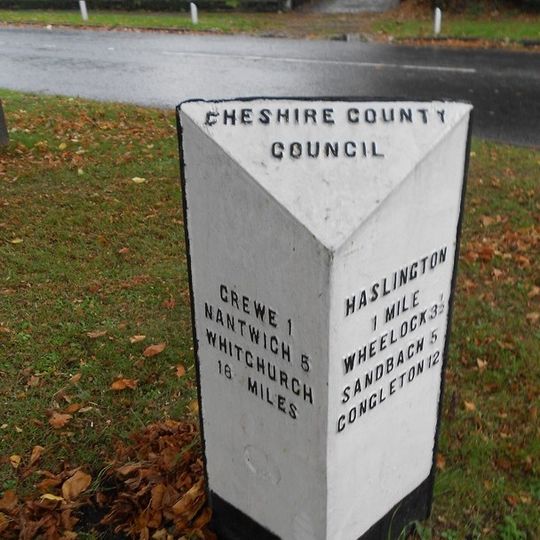 Milestone At Corner Of Narrow Lane