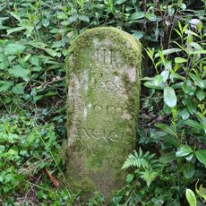 Milestone, Clapham, on track leading to Haldon House Hotel, 100m E of Animal Sanctuary and Kennels