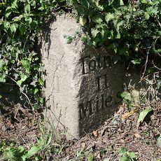Milestone, 50m uphill from Pig & Whistle PH, Littlehempston