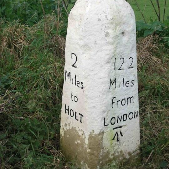 Milestone, c.halfway between lane to Hunworth to S, and Hill House