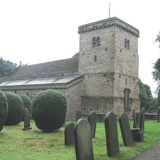 Church of St Michael And Grave Cover Leaning On Buttress Beside North Door