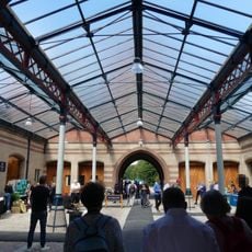 Coach House Court north of Stable Court with riding school and yard walls