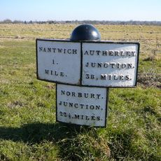 Shropshire Union canal milepost circa 75 metres south of Marsh Lane Bridge (Number 91) At Sj 641 515