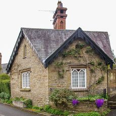 The Lodge, and attached wrought iron gates and railings with screen over