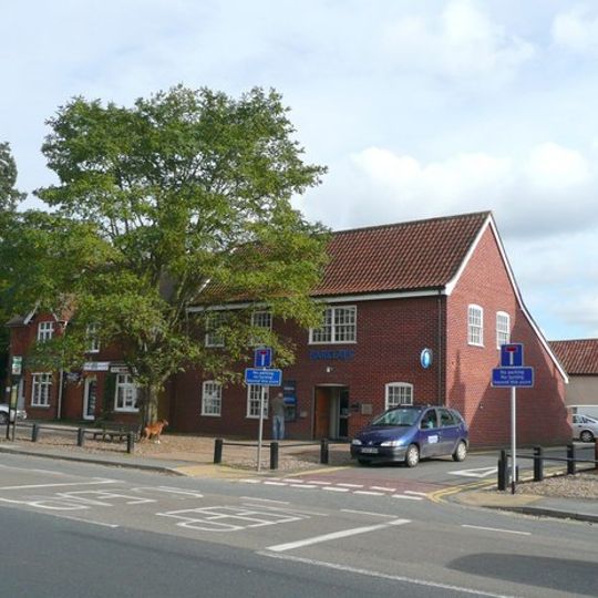 Barclays Bank and three adjoining tenements to north