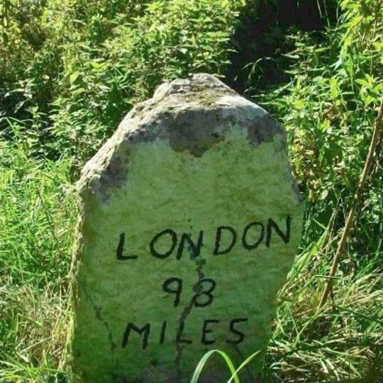 Milestone, 50yds S of wooden gate into St Peter's churchyard