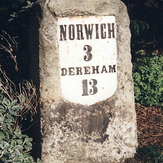 Milestone, 50yds W of jct with Three Mile Lane, on slip rd N of roundabout