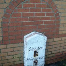 Milestone, by new road called Milestone way